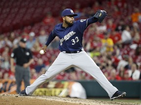 Milwaukee Brewers relief pitcher Jeremy Jeffress throws during the ninth inning of the team's baseball game against the Cincinnati Reds, Wednesday, May 2, 2018, in Cincinnati.