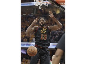 Cleveland Cavaliers' Tristan Thompson (13) reacts after dunking against the Boston Celtics in the first half of Game 3 of the NBA basketball Eastern Conference finals, Saturday, May 19, 2018, in Cleveland.