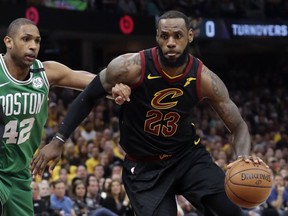 Cleveland Cavaliers' LeBron James (23) drives past Boston Celtics' Al Horford (42), from Dominican Republic, in the first half of Game 4 of the NBA basketball Eastern Conference finals, Monday, May 21, 2018, in Cleveland.