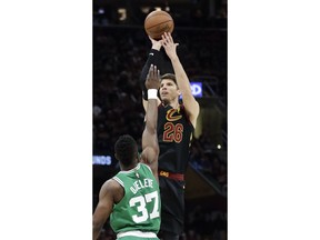 Cleveland Cavaliers' Kyle Korver (26) shoots over Boston Celtics' Semi Ojeleye (37) in the first half of Game 4 of the NBA basketball Eastern Conference finals, Monday, May 21, 2018, in Cleveland.