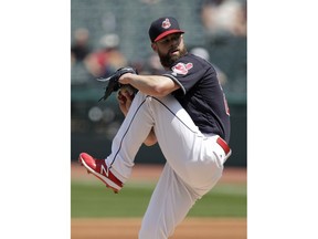 Cleveland Indians starting pitcher Corey Kluber delivers in the first inning of a baseball game against the Texas Rangers, Wednesday, May 2, 2018, in Cleveland.