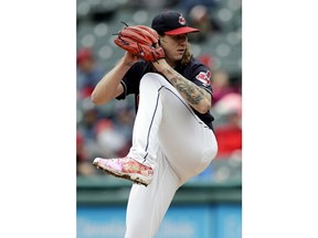 Cleveland Indians starting pitcher Mike Clevinger delivers in the first inning of a baseball game against the Kansas City Royals, Saturday, May 12, 2018, in Cleveland.