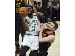 Boston Celtics' Jaylen Brown (7) drives to the basket against Cleveland Cavaliers' Kevin Love during the first half of Game 6 of the NBA basketball Eastern Conference finals Friday, May 25, 2018, in Cleveland.