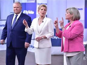 Liberal Premier Kathleen Wynne, centre, Progressive Conservative Leader Doug Ford, left, and NDP Leader Andrea Horwath take part in the Ontario Leaders debate in Toronto on Monday, May 7, 2018. This is the first of three debates scheduled before the June 7 vote.