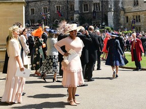 US TV talk host Oprah Winfrey (C) leaves after attending the wedding ceremony of Britain's Prince Harry, Duke of Sussex and US actress Meghan Markle at St George's Chapel, Windsor Castle, in Windsor, on May 19, 2018.