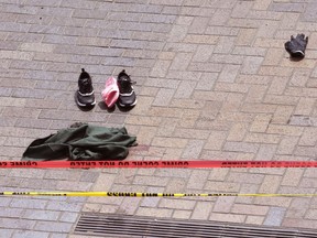 Clothing is strewn on the sidewalk at the scene where pedestrians were hit by a motorists in Portland, Ore., Friday, May 25, 2018. Authorities say paramedics tended to "multiple patients" after a hit-and-run driver struck pedestrians in downtown Portland.