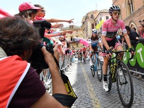 Britain's Simon Yates wears the pink jersey of the overall leader at the start of the 12th stage of the Giro d'Italia cycling race from Osimo to Imola, Italy, Thursday, May 17, 2018.