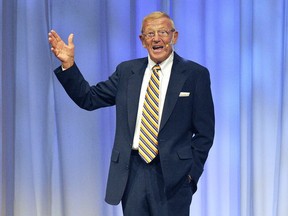 FILE - In this Oct. 11, 2017, file photo, Lou Holtz speaks at the Manufacturer & Business Association's 112th Annual Event at the Bayfront Convention Center in Erie, Pa. Attorneys for Lou Holtz say the former Notre Dame coach and the news website The Daily Beast have settled a defamation lawsuit filed by the ex-ESPN analyst and college football Hall of Famer. Orlando, Florida, law firm Morgan & Morgan announced in a news release Monday, May 21, 2018, the two sides came to an amicable resolution.