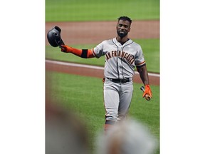 San Francisco Giants' Andrew McCutchen acknowledges fans as he walks to the batter's box during the first inning of the team's baseball game against his former team, the Pittsburgh Pirates, in Pittsburgh, Saturday, May 12, 2018.
