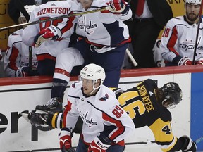 Washington Capitals' Tom Wilson (43) collides with Pittsburgh Penguins' Zach Aston-Reese (46) during the second period in Game 3 of an NHL second-round hockey playoff series in Pittsburgh, Tuesday, May 1, 2018.