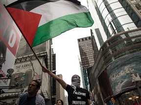 Members of the Palestinian community and their supporters rally in New York City's Times Square on May 18, 2018.