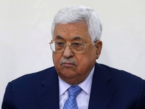 FILE -- In this March 1, 2018 file photo, Palestinian President Mahmoud Abbas attends a meeting of the Fatah Revolutionary Council in the West Bank city of Ramallah. Abbas was discharged Monday, May 28, 2018, from a West Bank hospital more than a week after he was hospitalized for fever and pneumonia.