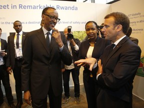French President Emmanuel Macron, right, chats with Rwanda's President Paul Kagame at the VivaTech gadget show in Paris, Thursday, May 24, 2018. Macron took on Facebook CEO Mark Zuckerberg and other internet giants Wednesday at a Paris meeting to discuss personal data protection and taxes as France pushes for tougher European regulations.