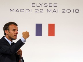 French president Emmanuel Macron speaks during the presentation of the French government's battle plan for the country's most deprived areas, Tuesday May 22, 2018 at the Elysee Palace in Paris.