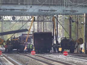 Emergency personnel work at the scene after multiple cars from a Norfolk Southern freight train detailed in Ridley Park, Pa., Thursday, May 3, 2018. Amtrak said service between Philadelphia and Washington has been temporarily suspended due to the derailment.