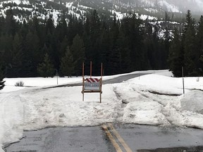 This photo provided by the Parks County Sheriff's Office, shows tire tracks in snow where two men drove past a road-closed sign in northwest Wyoming on Tuesday, May 1, 2018, while trying to get to Yellowstone National Park. The Park County Sheriff's Office says the men had to be rescued after their Nissan SUV got stuck in snow.