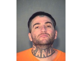 This undated photo provided by the Arizona Department of Corrections shows Aaron Levi Schmidt. Authorities say Schmidt drove an associate who was in a white supremacist group to a park in north Phoenix where the associate, who is accused of fatally shooting a white woman because she was dating a black man. Schmidt has pleaded guilty to charges of murder and assisting a criminal gang.