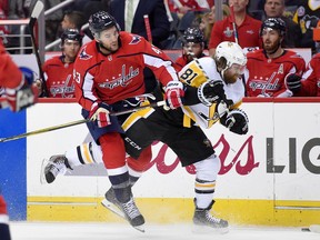 Washington Capitals winger Tom Wilson (left) collides with Pittsburgh Penguins winger Phil Kessel on April 29.