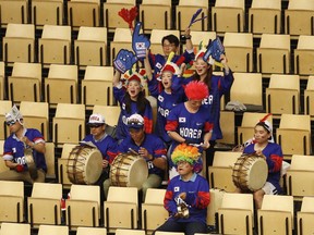 Group of South Korea's fans cheers for their team before the start of the Ice Hockey World Championships group B match between South Korea and Latvia at the Jyske Bank Boxen arena in Herning, Denmark, Tuesday, May 8, 2018.