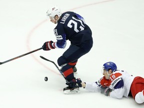 Czech Republic's Dominik Kubalik, right, challenges for the puck with Dylan Larkin, left, of the United States during the Ice Hockey World Championships quarterfinal match between the United States and Czech Republic at the Jyske Bank Boxen arena in Herning, Denmark, Thursday, May 17, 2018.