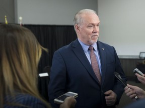 British Columbia Premier John Horgan takes questions from the media at the Western Premiers' Conference in Yellowknife, N.T., Wednesday, May 23, 2018.
