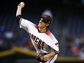 Arizona Diamondbacks starting pitcher Zack Greinke throws a pitch against the Los Angeles Dodgers during the first inning of a baseball game Monday, April 30, 2018, in Phoenix.