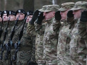 In this file photo taken Jan. 12, 2017, the first U.S. troops arrive at the Zagan base in western Poland as part of deterrence force of some 1,000 troops to be based there.