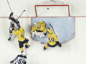 Paul Stastsny of the Winnipeg Jets scores past Nashville Predators' goaltender Juuse Saros during Game 7 action in their Western Conference semifinal Thursday in Nashville. The Jets were 5-1 winners, giving them the series 4-3 and advancing against the Vegas Golden Knights in the conference final beginning Saturday in Winnipeg.