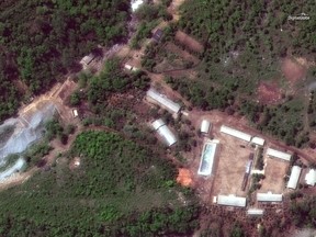 This Wednesday, May 23, 2018 satellite image provided by DigitalGlobe shows the Punggye-ri test site in North Korea.  A group of foreign journalists departed by train Wednesday to watch the dismantling of North Korea's nuclear test site after eight reporters from South Korea received last-minute permission to join them. (DigitalGlobe via AP)