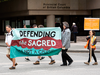 Supporters for protesters arrested while demonstrating against the Kinder Morgan pipeline rally outside B.C. Supreme Court ahead of a court hearing in Vancouver, May, 7, 2018.