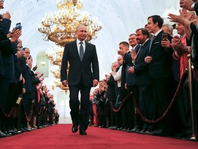 Russian president-elect Vladimir Putin procedes to his inauguration ceremony at the Kremlin in Moscow on May 7, 2018.