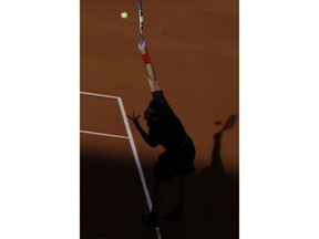 Dominic Thiem of Austria serves to Alexander Zverev of Germany during the men's final of the Madrid Open Tennis tournament in Madrid, Spain, Sunday May 13, 2018.