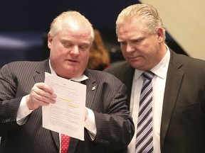 Mayor Rob Ford with his brother councillor Doug Ford as Toronto City Council debates the budget  on Thursday, January 30, 2014.