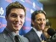 In this July 22, 2014 file photo, Toronto Maple Leafs assistant general manager  Kyle Dubas (left) and team president Brendan Shanahan speak to reporters in the dressing room at the Air Canada Centre.