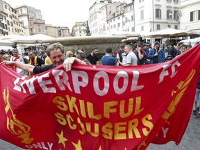 Liverpool fans holds a banner before the Champions League semifinal second leg soccer match between Liverpool and AS Roma, scheduled at the Olympic stadium, in Rome, Wednesday, May 2, 2018.