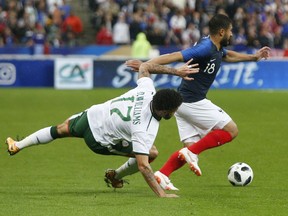 France's Nabil Fekir, right, challenges for the ball with Ireland's Alan Browne during a friendly soccer match between France and Ireland at the Stade de France stadium, in Saint Denis, north of Paris, France, Monday, May, 28, 2018.