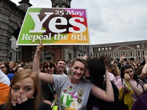 A "Yes" voter breaks down in tears as the result of the Irish referendum on the 8th amendment, concerning the country's abortion laws, is declared at Dublin Castle on May 26, 2018.