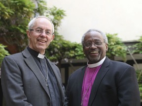 Archbishop of Canterbury Justin Welby (L) and US Bishop Michael Bruce Curry pose outside St George's Chapel, in Windsor on May 18, 2018, on the eve of the wedding of Britain's Prince Harry and US actress Meghan Markle.