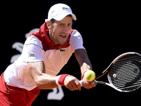 Serbia's Novak Djokovic returns the ball to Spain's Rafael Nadal during their semifinal match at the Italian Open tennis tournament, in Rome, Saturday, May 19, 2018.