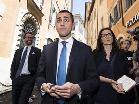 Five-Star Movement leader Luigi Di Maio leaves the Italian parliament in Rome Friday, May 25, 2018. Italy's premier-designate Giuseppe Conte is finalizing his proposed cabinet list as European leaders begin weighing in on the EU's future with decidedly euroskeptic and populist Italy in its ranks.