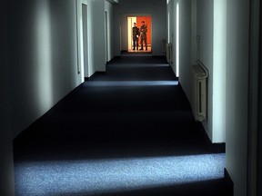 In this Wednesday, Nov. 9, 2005, file picture Romanian military staff stand at the end of a corridor on the Mihail Kogalniceanu airbase, near the Black Sea port of Constanta, Romania, a Soviet-era facility which became a key focus of a European investigation into allegations that the CIA operated secret prisons.