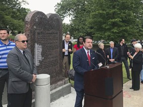 FILE - In this April 26, 2018, file photo, Arkansas Republican state Sen. Jason Rapert speaks at the unveiling of a Ten Commandments monument outside the Arkansas state Capitol in Little Rock. Opponents of the display filed lawsuits Wednesday, May 23  to have the monument removed, arguing it's an unconstitutional endorsement of religion by government. A 2015 law required the state to allow the privately funded monument.
