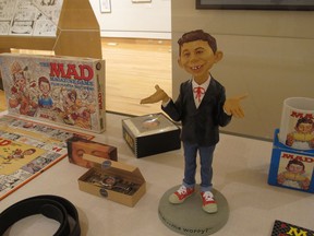 A new exhibit celebrating the artistic legacy of MAD magazine that includes several examples of magazines over the years is displayed on Thursday, May 3, 2018, in Columbus, Ohio. "Artistically Mad: Seven Decades of Satire" opens at the Billy Ireland Cartoon Library & Museum at Ohio State University on Saturday, May 5, and runs through Oct. 21. The exhibit will include original drawings and paintings, displays of vintage MAD magazines and memorabilia such as trading cards and board games.