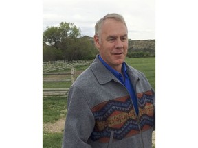 U.S. Interior Secretary Ryan Zinke speaks with reporters during a visit to the Theodore Roosevelt National Park Tuesday, May 22, 2018, in western North Dakota. Zinke reiterated his support for addressing a maintenance backlog at national parks during a visit to the one named for the U.S. president known for being a champion of conservation.