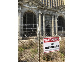 This May 25, 2018, photo shows the old Michigan Central Station in Detroit.  Ford Motor Co. board member Edsel B. Ford II has said the company was in talks with the train station's owner about buying it, but some won't believe it until they see the Dearborn, Michigan-based automaker inside the 105-year-old building.