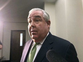 John Morgan, who helped get Florida's medical marijuana amendment on the ballot and passed in 2016, takes questions before a trial on whether the ban on smoking cannabis is allowed under the state constitution on Wednesday, May 16, 2018, in Tallahassee, Fla.