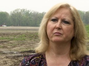 In a frame from video Konnie Beyma is interviewed near the excavation site in Macomb Township, Mich., Monday, May 14, 2018, where police have resumed digging in an area that might yield the remains of several missing girls. Beyma's sister, Kimberly King, disappeared in 1979 at age 12. Beyma says police believe they "are very close" to finding remains. The search began after police interviewed a prisoner locked up for the slaying of a 13-year-old girl whose remains were found in 2008 near the same area.