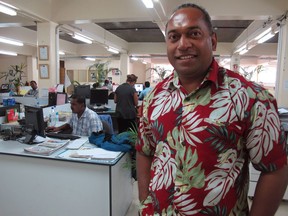 In this Nov. 6, 2013 photo, Fiji Times newspaper editor Fred Wesley stands in the newsroom in Suva, Fiji. Wesley was sentenced to six months in jail, suspended for two years, for reprinting an article from a New Zealand newspaper that said Fiji's judiciary is not independent. An opinion writer and three newspaper executives in Fiji are awaiting a judge's verdict Friday, May 18, 2018, on sedition charges in a case that has major implications for press freedom in the South Pacific nation.