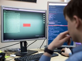 A security company employee develops a computer code in an office in Moscow, Russia, on Oct. 25, 2017.