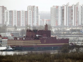 The floating nuclear power plant, the 'Akademik Lomonosov', is towed out of the St. Petersburg shipyard where it was constructed in St.Petersburg, Russia, Saturday, April 28, 2018.